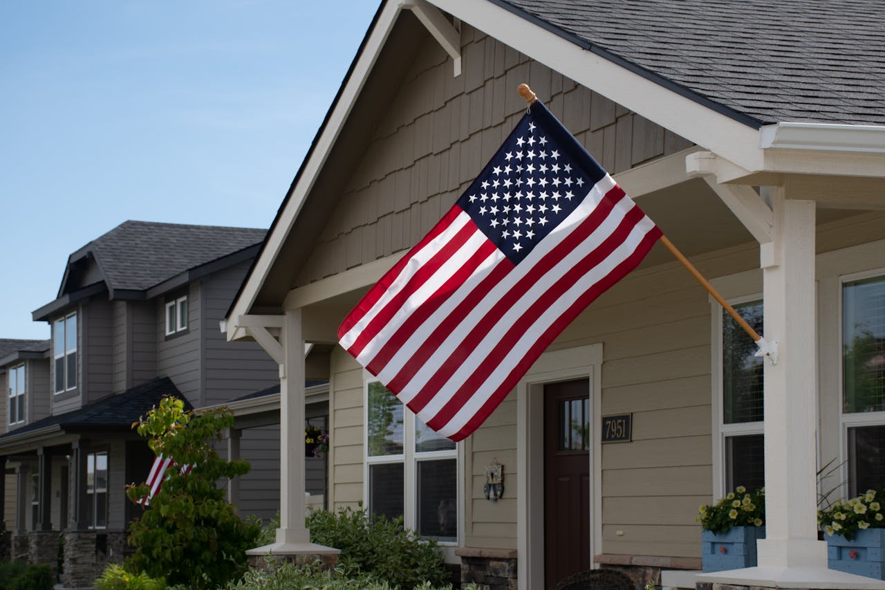 USA flag on fence suburban home