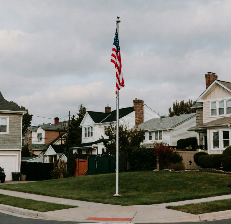 american flagpole placed for high visibility on corner lot
